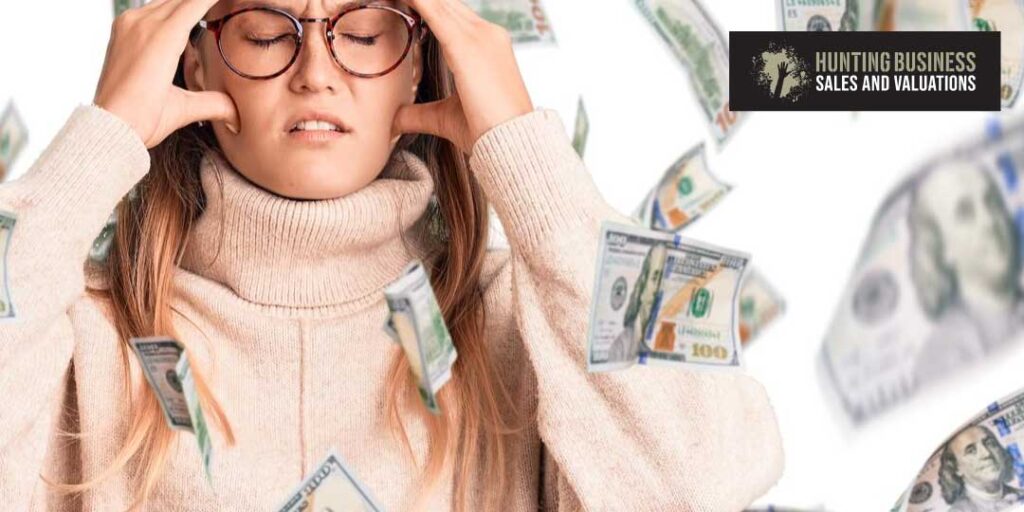 The curse of Marketing Fees when selling your Business article feature image of a stressed woman watching her money float away